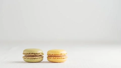 Colorful macaroons on white background, video of increase in profits  Stock Footage 254795877