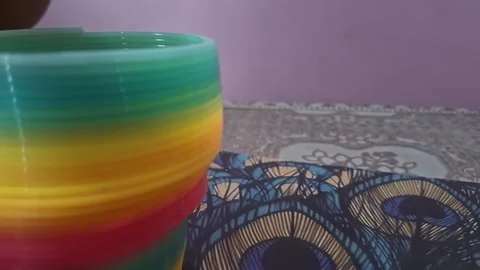Colorful magic rainbow spring toy stretching dynamically with vibrant coils Stock Footage 334555070