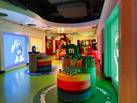 Colorful Mand M's store interior in London, UK with candy displays, branded.. Stock Photos