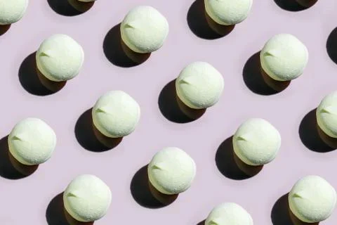 Colorful marshmallow pattern on a colored background top view 스톡 사진