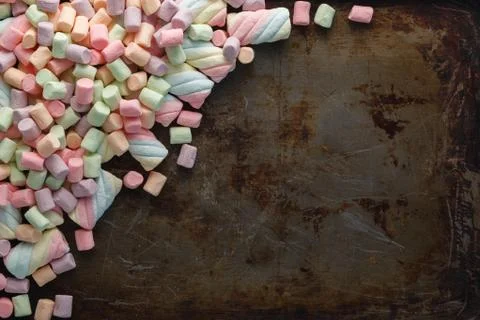 Colorful marshmallows on an old rustic iron table, macro texture background.. Stock-Fotos