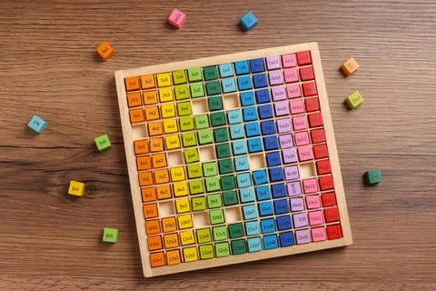 Colorful math game kit with arithmetical tasks on wooden table, flat lay Stock Photos