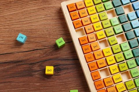 Colorful math game kit with arithmetical tasks on wooden table, flat lay Stock Photos