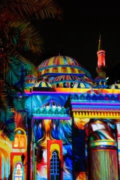Colorful Middle Eastern patterns and drawings displayed on a mosque Stock Photos