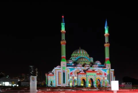 Colorful Middle Eastern patterns displayed on a mosque - Sharjah lights festival Stock Photos