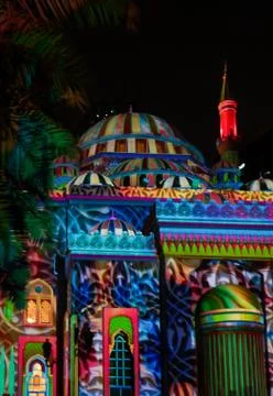 Colorful Middle Eastern patterns displayed on a mosque - Sharjah lights festival Stock Photos