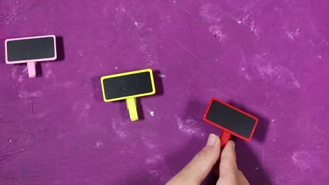 Colorful Mini Chalkboard Clips Blank Labels for Signs, Tags and Display on pink  Stock Footage 339959962