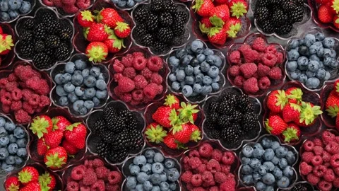 Colorful Mixed Berries Rotating in Small Bowls Flat Lay Stock Footage 346249299