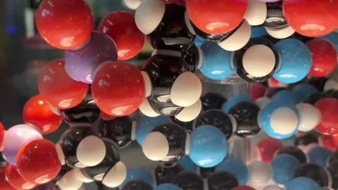 Colorful molecular model close-up with glossy spheres representing atoms Stock Footage 313298080