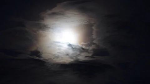 Colorful Moon Shot Behind the Clouds - real time - overexposed Video stock 85325596
