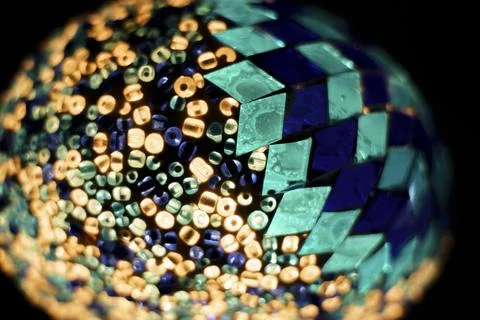 A colorful, multi-colored object with a blue and green design. The object i.. Fotos Stock