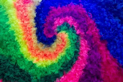 Colorful multi-colored spiral pattern of the rainbow made of fabric Stock Photos