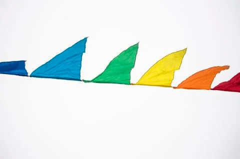 Colorful multicolored triangular flags, isolated on a white background, hang  스톡 사진