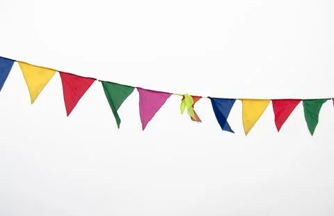 Colorful multicolored triangular flags, isolated on a white background, hang  写真素材