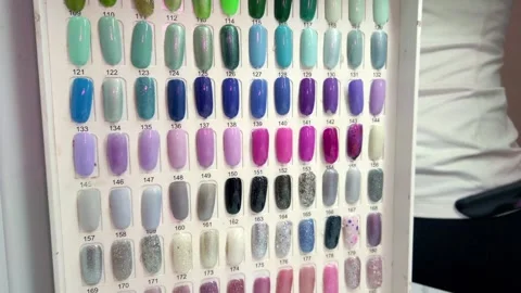 Colorful Nail Polish Sample Display Showcasing Manicure Color Selection Options 動画素材 337463857