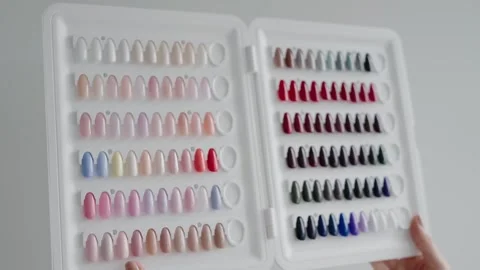 Colorful Nail Polish Samples in Display Case for Manicure and Pedicure Selection Stock Footage 342804691