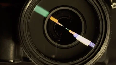 Colorful neon light reflections inside a camera lens elements close up Vídeo Stock 337406863