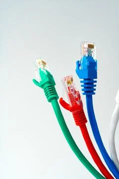 Colorful network cables switch on white background Stock Photos