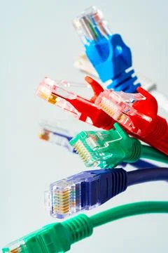 Colorful network cables switch on white background Stock Photos