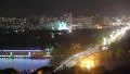 Colorful night city scape bridge over river, ferry cars drive HD Footage
