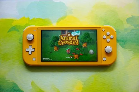 Colorful Nintendo Switch Consoles Featuring Popular Games Stock Photos