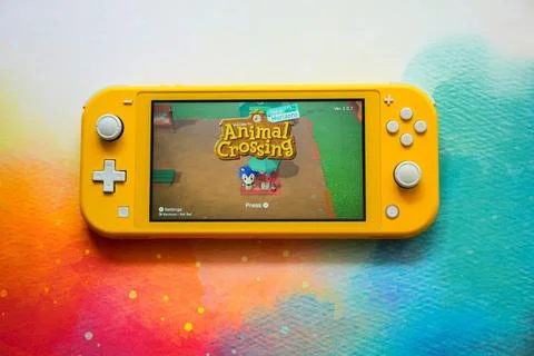 Colorful Nintendo Switch Consoles Featuring Popular Games Stock Photos