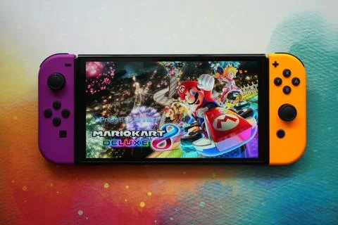 Colorful Nintendo Switch Consoles Featuring Popular Games Stock Photos