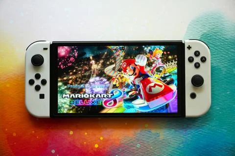 Colorful Nintendo Switch Consoles Featuring Popular Games Stock Photos