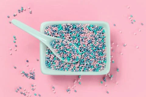 Colorful nonpareils cake sprinkles in rectangular bowls Stock Photos