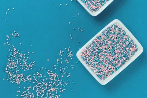 Colorful nonpareils cake sprinkles in rectangular bowls Stock Photos