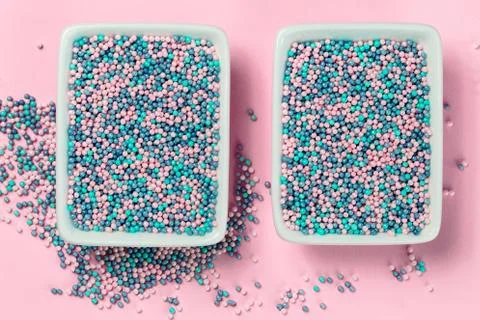 Colorful nonpareils cake sprinkles in rectangular bowls Stock Photos
