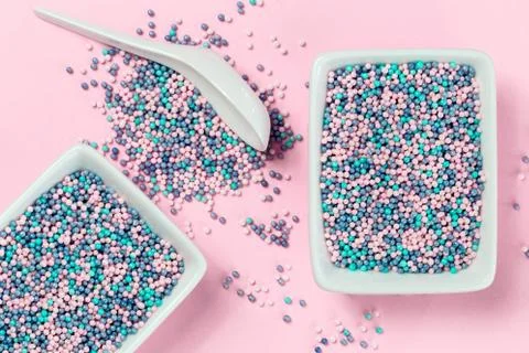 Colorful nonpareils cake sprinkles in rectangular bowls Stock Photos