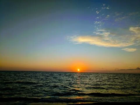 Colorful ocean sunset Stock Photos