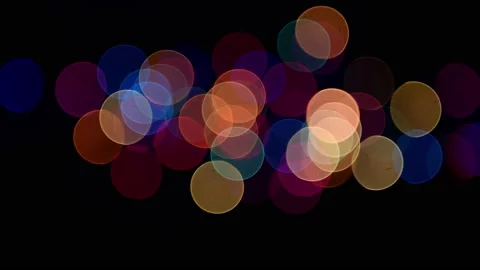Colorful out of focus bokeh blinking festive lights isolated on black Stock Footage 163936005