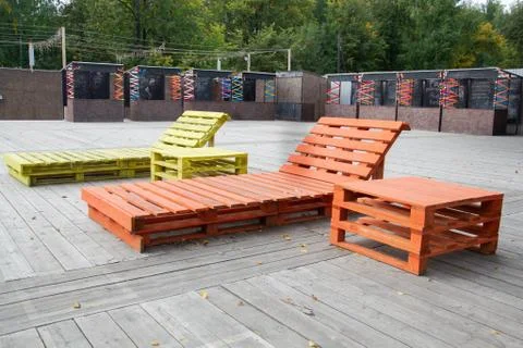 Colorful outdoor furniture made of wood and pallets, yellow, blue, orange Stock Photos