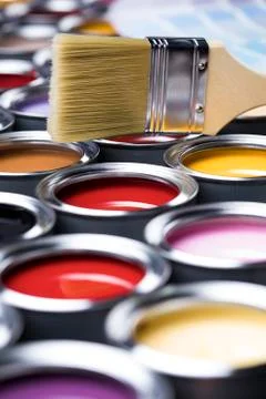 Colorful paint cans with paintbrush Free Stock Photos