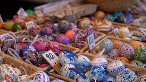 Colorful painted easter eggs in basket at the traditional European market. Stock Footage 125901662