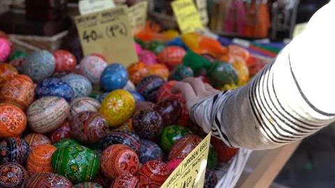 Colorful painted easter eggs in basket at the traditional European market. Stock Footage 125901929