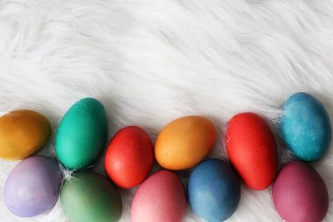 Colorful Painted Easter Eggs Framing Fluffy White Background Stock Photos