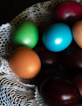 Colorful painted easter eggs on white lace Stock Photos