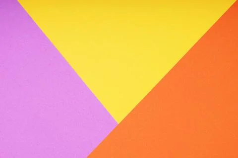 Colorful paper background with triangle pattern in pink yellow and orange ... Stock Photos