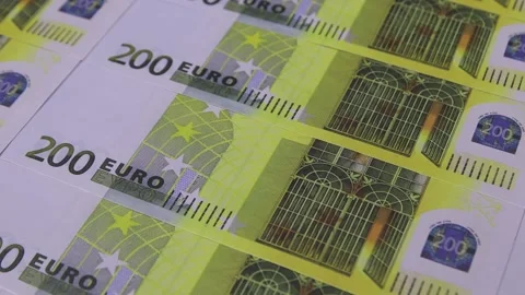 Colorful paper clips fall on the table laid out 200 euros banknotes Vídeo Stock 145304327