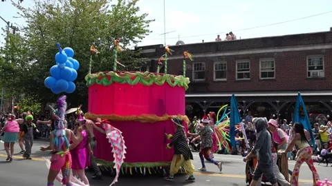 Colorful parade float and costumed dancers in street procession Stock Footage 339036408