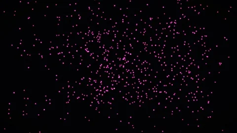 Colorful particles floating on a black background in a random pattern Stock Footage 341914048