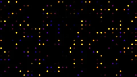 Colorful particles move in random patterns on a dark Stock Footage 338317110