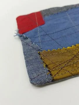 Colorful patchwork coaster from recycled fabric Stock Photos