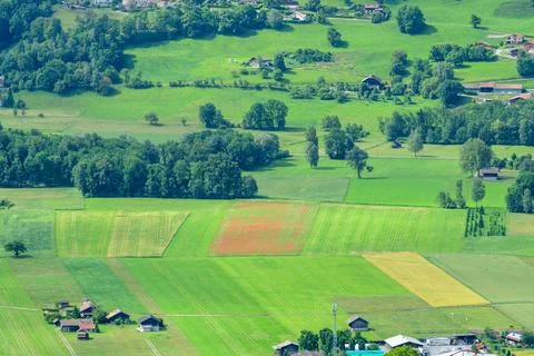 Colorful patchwork fields and rural homes, Passy Stock Photos