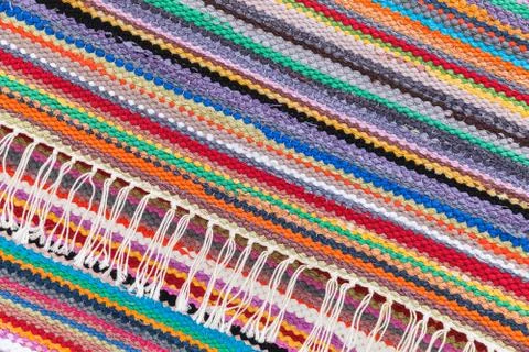 Colorful patchwork rug with striped pattern Stock Photos