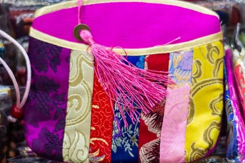 Colorful Patchwork Textile Pouch with Pink Tassel Stock Photos