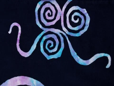 Colorful pattern on black fabric batik as background 스톡 사진